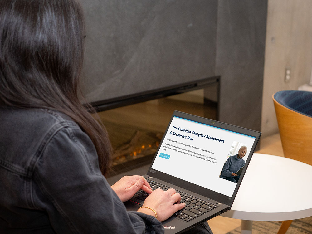 user on their computer navigation baycrest's canadian caregiver assessment and resources tool