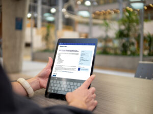 person on tablet looking at Memory Link program at Baycrest